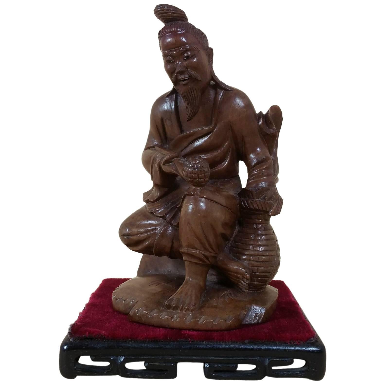 Japanese Fruitwood Carving of a Gentleman Smoking a Pipe