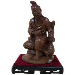 Antique Japanese Fruitwood Carving of a Gentleman Smoking a Pipe