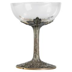 Anonymous, a Silver and Clear Glass Champagne Glass