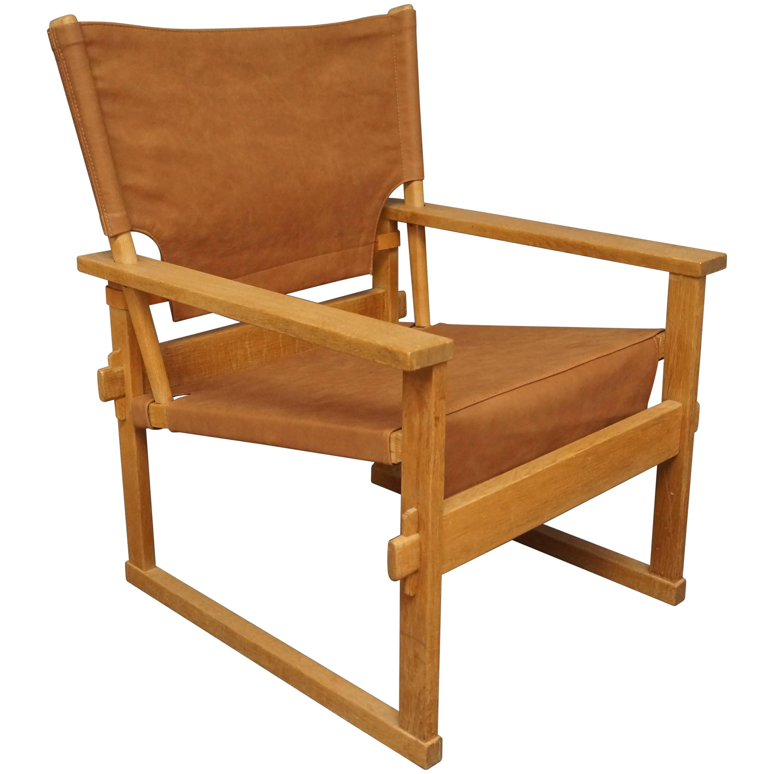 Lounge Chair in Oak and Brown Patinated Leather by Poul Hundevad, 1960s For Sale