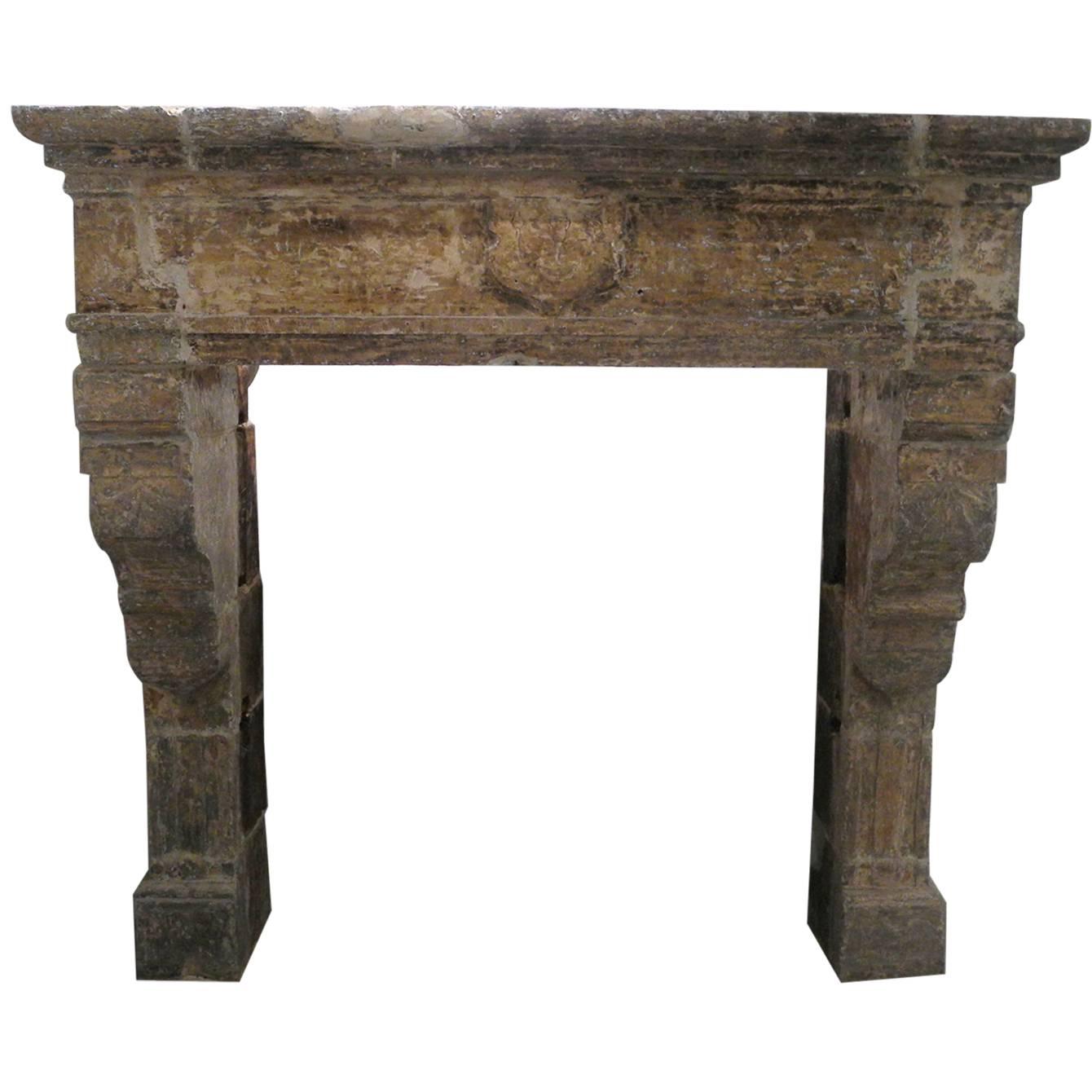 Antique Renaissance Mantel with Carved Legs and Crest Atop For Sale