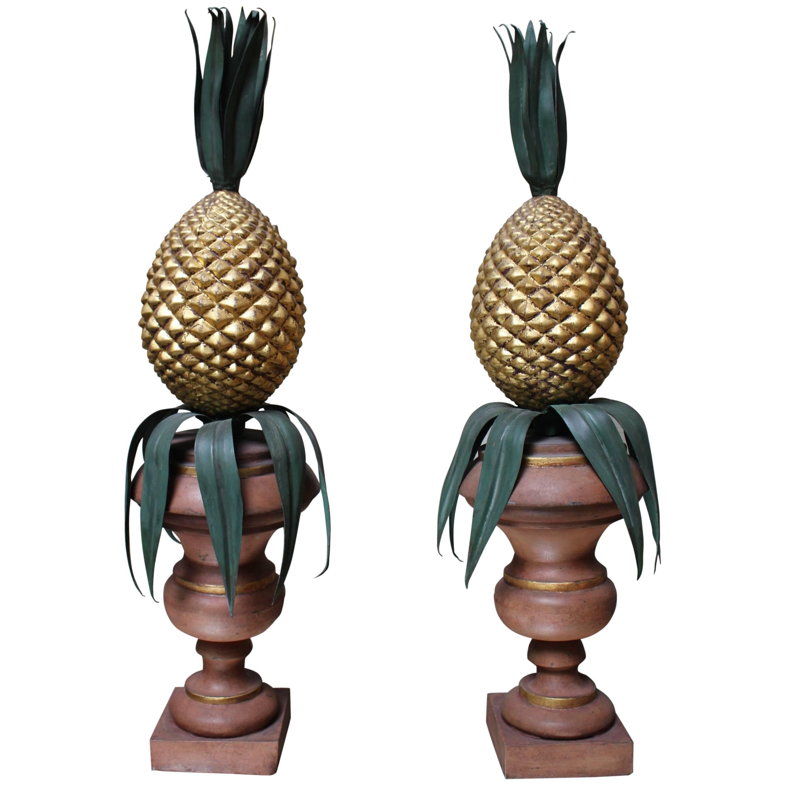 Pair of Italian Painted and Gilded Tole Urns with Pineapples