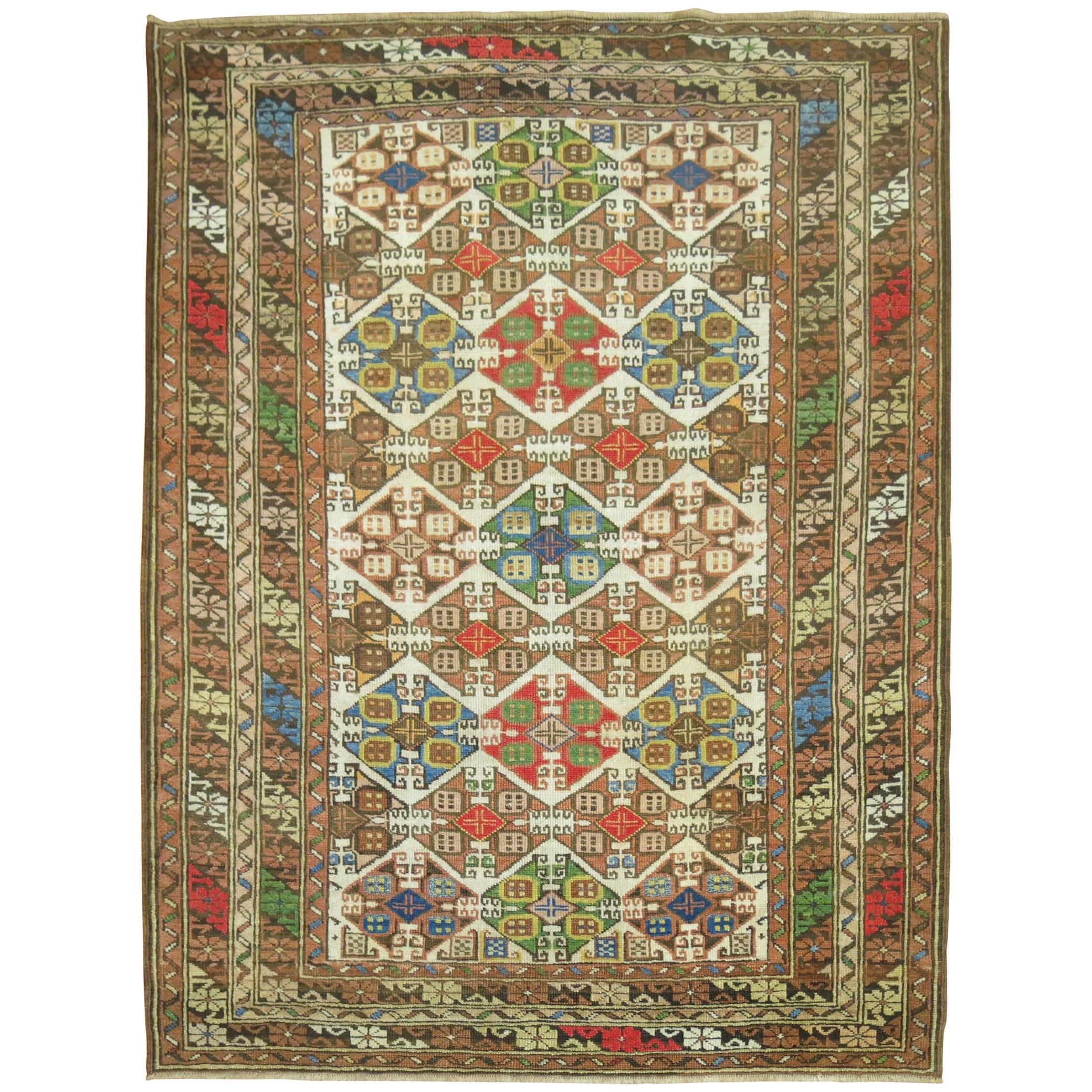 Zabihi Collection Colorful Antique Caucasian Rug For Sale