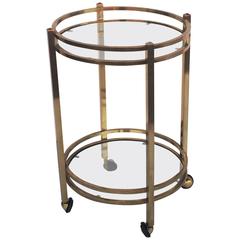 French Two-Tiered Round Table of Brass and Glass on Rolling Casters