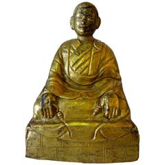 Tibetan Gilt Copper Repousse Figure of an Arhat