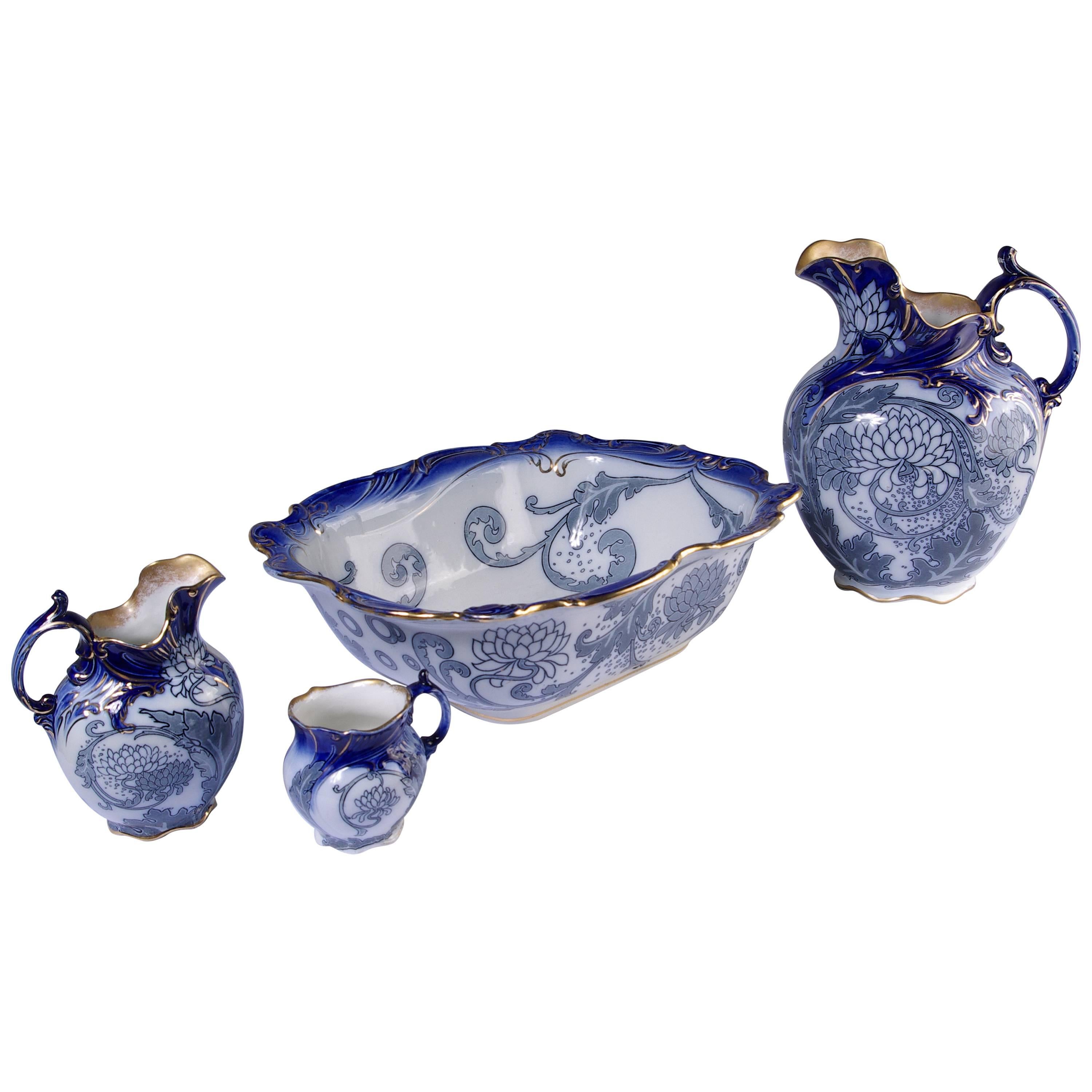 Antique Four-Piece Royal Doulton Floral Blue Pitcher, Wash Basin, Jug and Mug