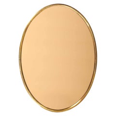 Large Italian Fontana Arte Oval Brass Wall Mirror with Rose Gold Glass (1960s)
