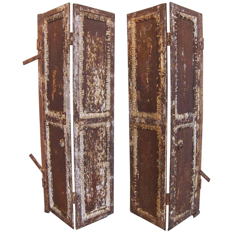 Pair Of Antique Industrial Neoclassical Greek Key Cast Iron Doors Pair of Antique Industrial Neoclassical Greek Key Cast Iron Doors Window Shutter For Sale - Pair Of Antique Industrial Neoclassical Greek Key Cast Iron Doors