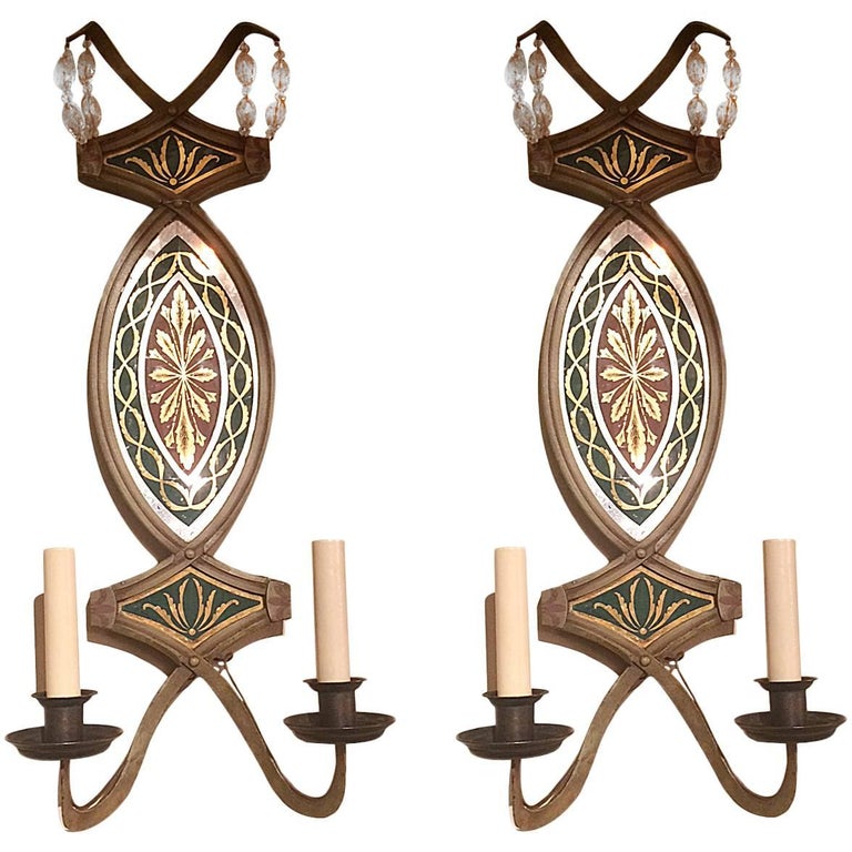 Pair of circa 1940's French églomisé mirror sconces with painted metal body sconces.

Measurements:
Height: 24