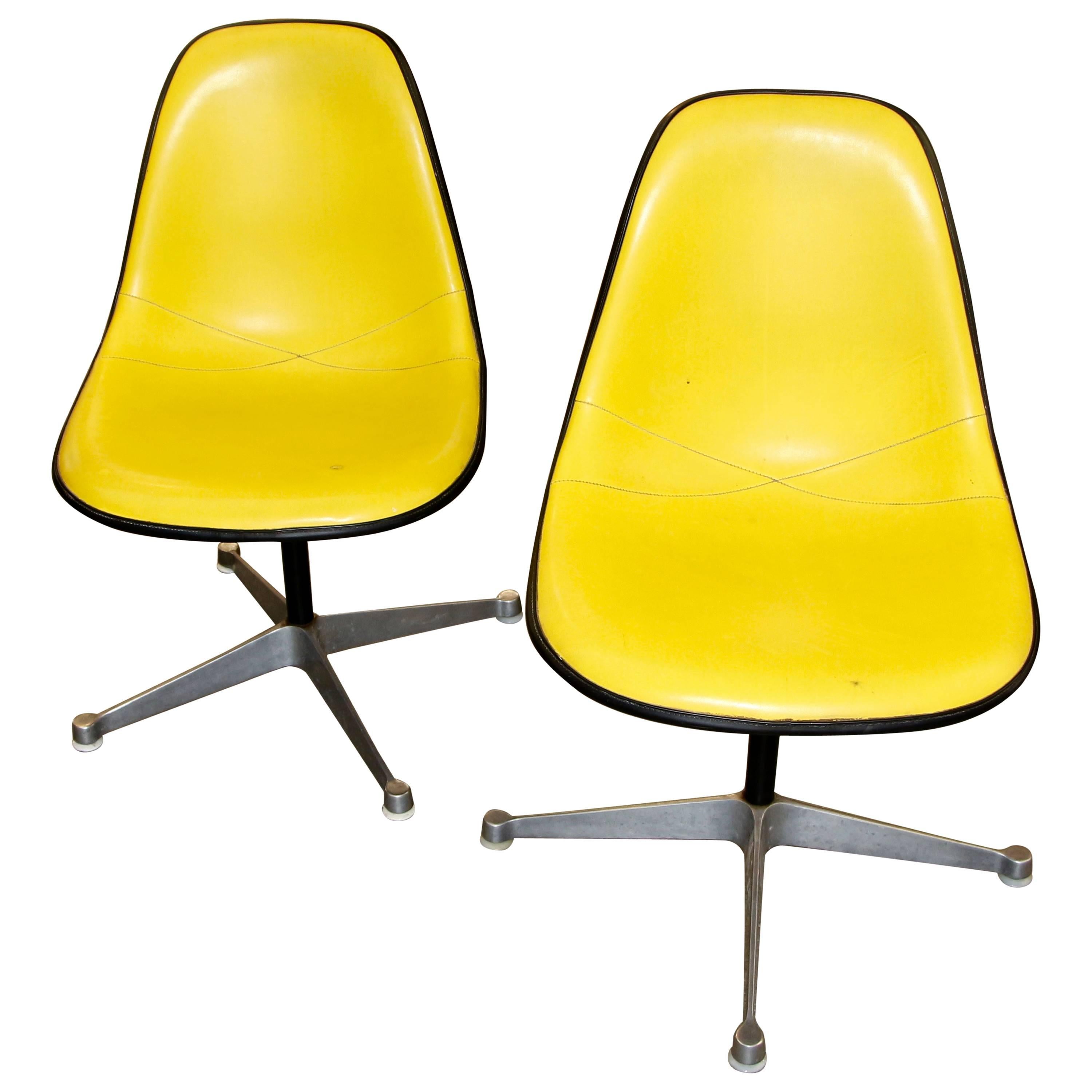 Two Herman Miller Adjustable Swivel Chairs with Naugahyde Covers