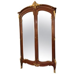 French armoire Louis XV Style with bronze dore mounts and beveled mirror doors