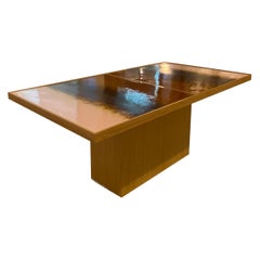 Sculptural coffee table with a glazed ceramic top