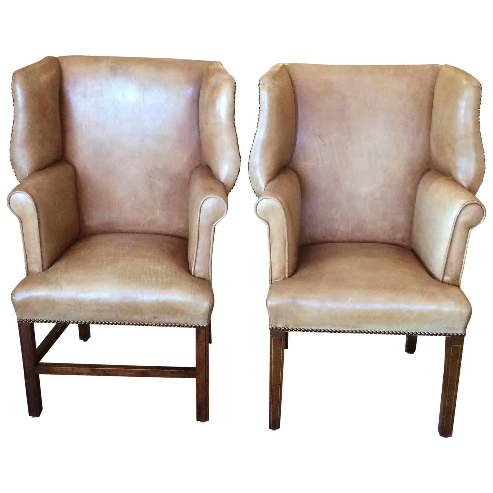 Pair of Petite Distressed Leather Chippendale Style Wing Chairs