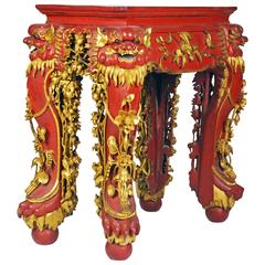 Chinoiserie Style Elaborately Carved Red Lacquer and Gilt Foo Dog Themed Table