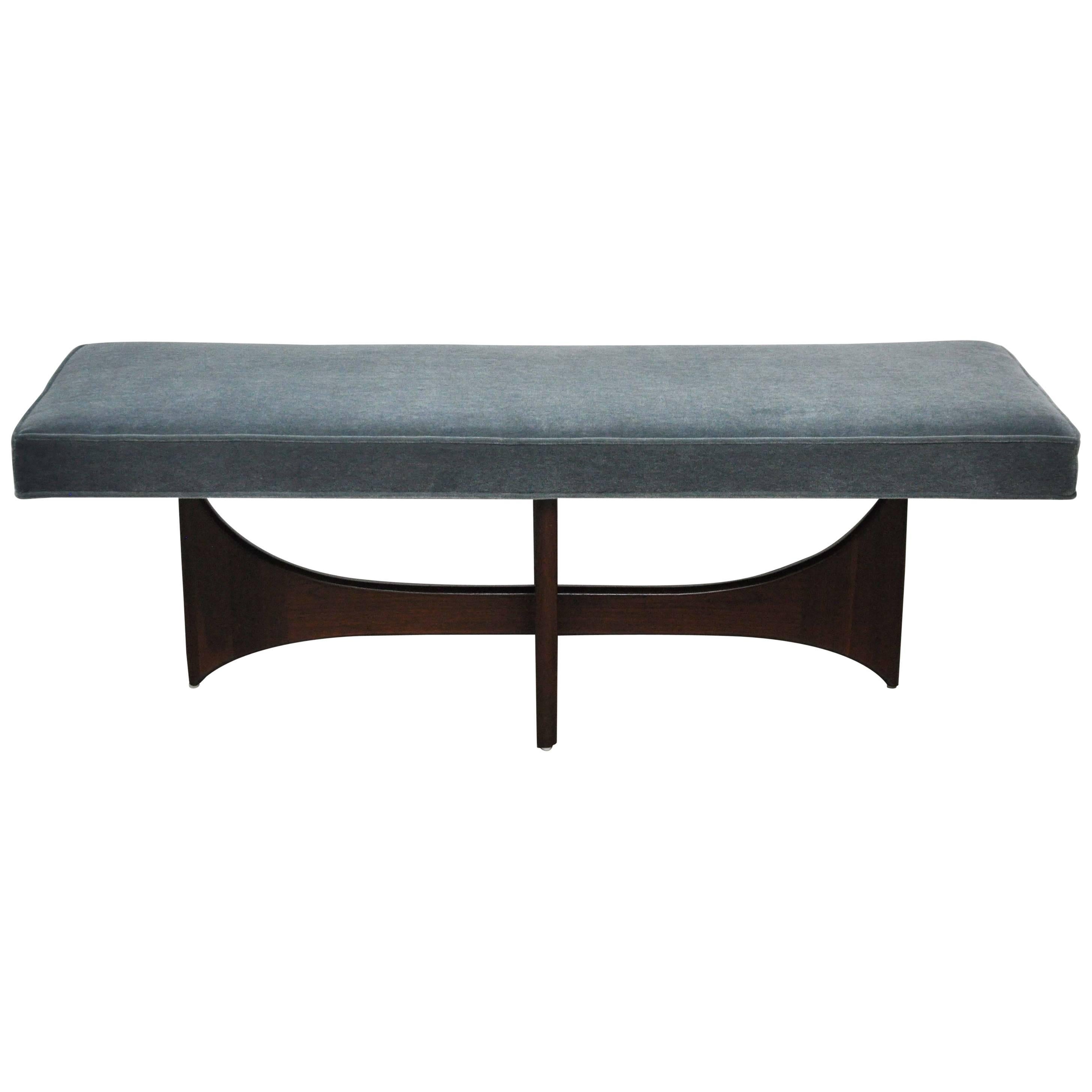 Sculptural walnut base by Adrian Pearsall. New bench top upholstered in blue mohair.

Pair available.