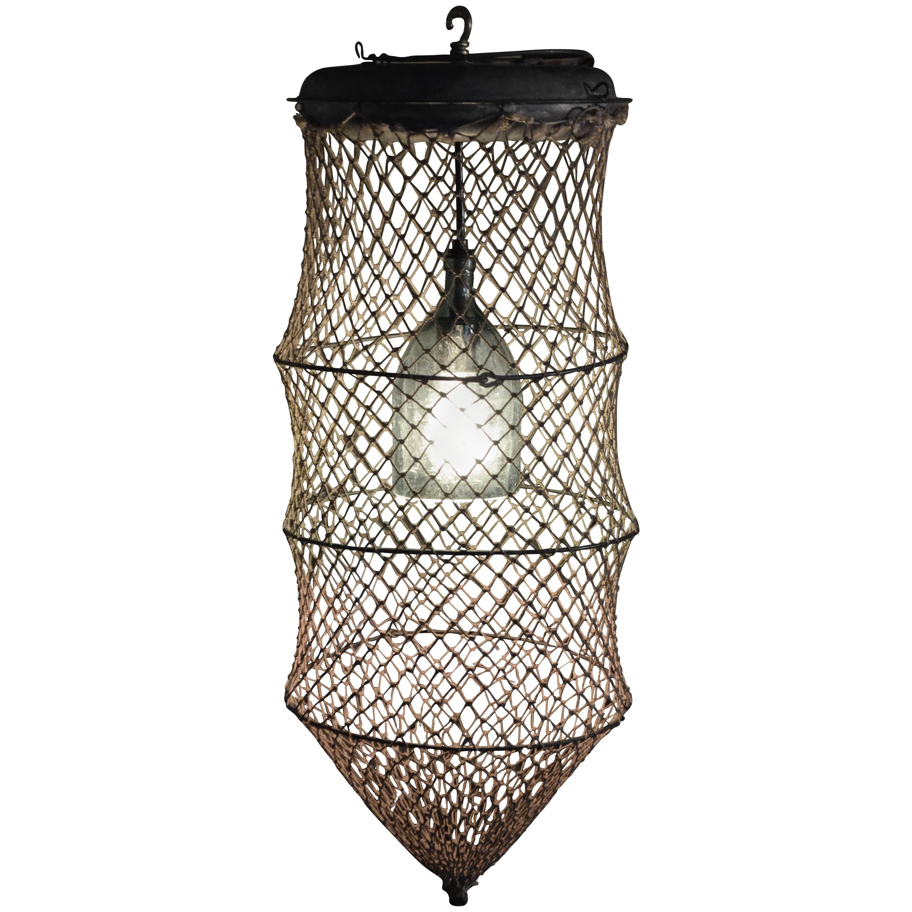 Pendant Light from Seltzer Bottle Mounted Inside Fish Trap