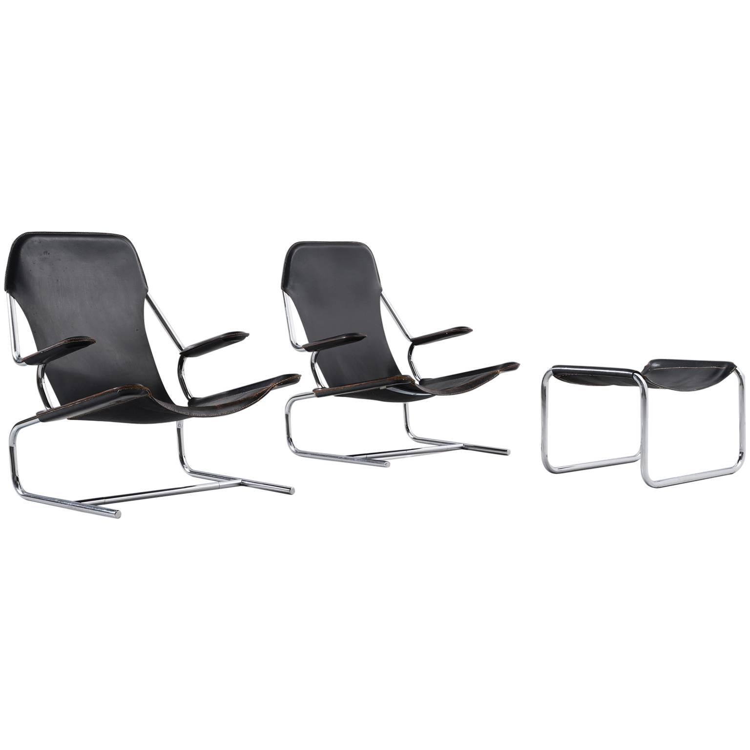 Pair of Tubular Lounge Chairs and Ottoman in Black Leather Upholstery