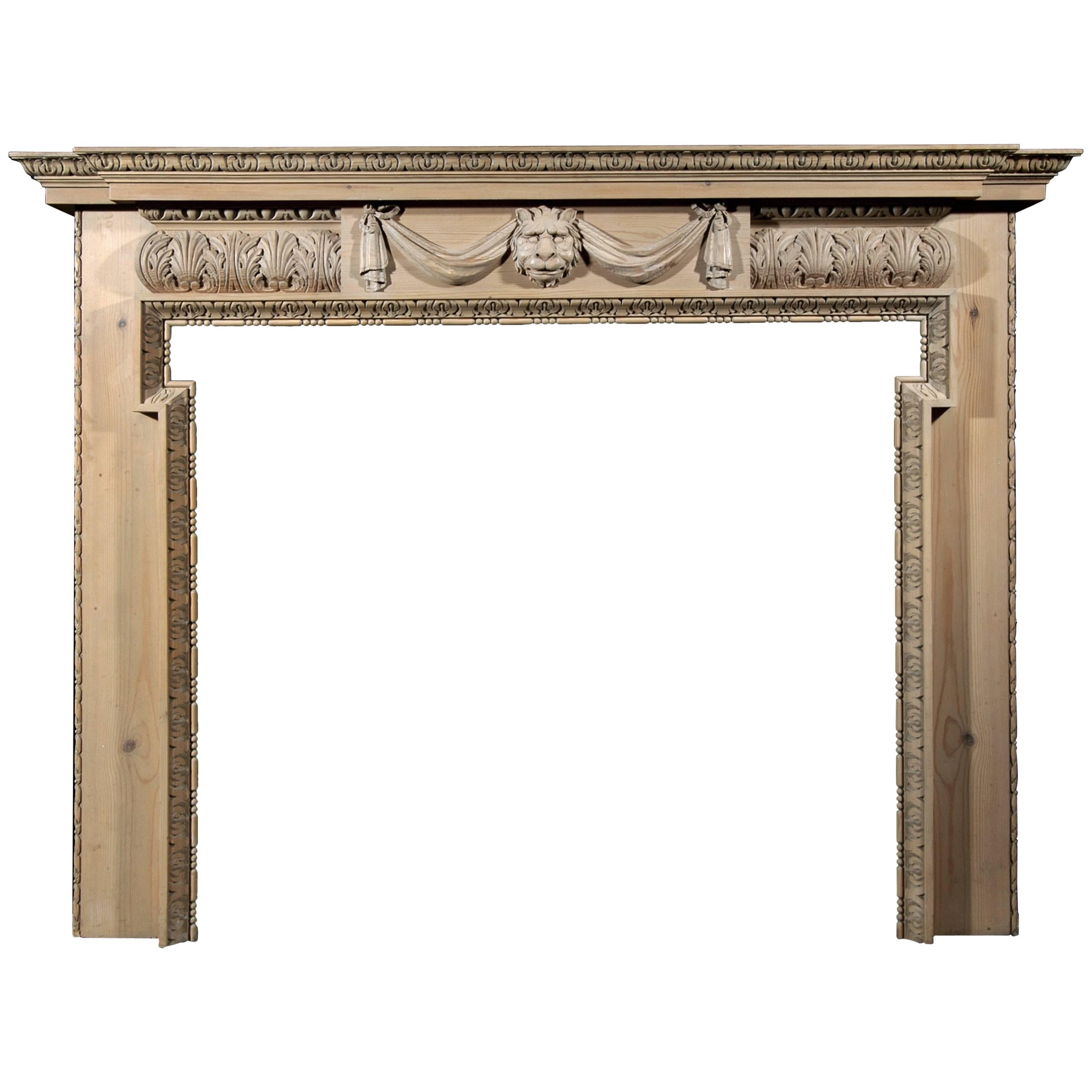 Carved Pine Fireplace with Lion's Mask and Drapery