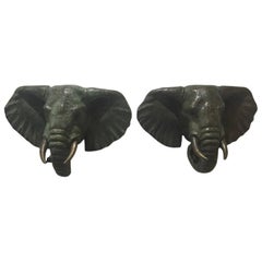 Paire de têtes d'éléphants en bronze