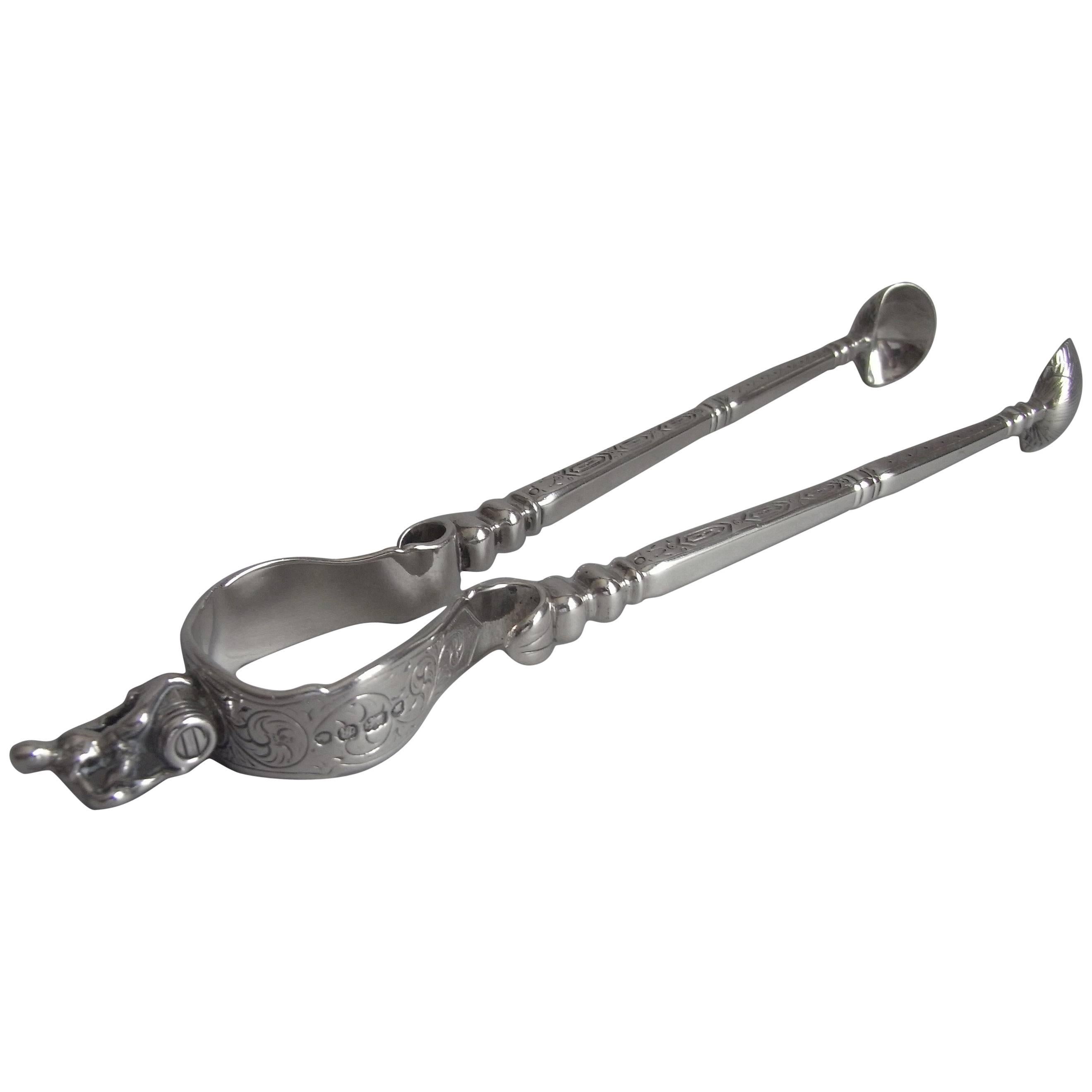 Extremely Rare Pair of Sugar Tongs Modelled as a Pair of Fire Irons