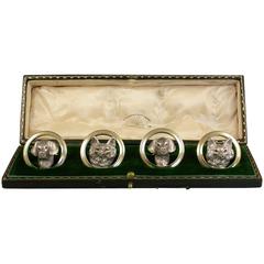 Cased Set of Four George V Cast Silver and Gilt Fox and Hound Menu Holders
