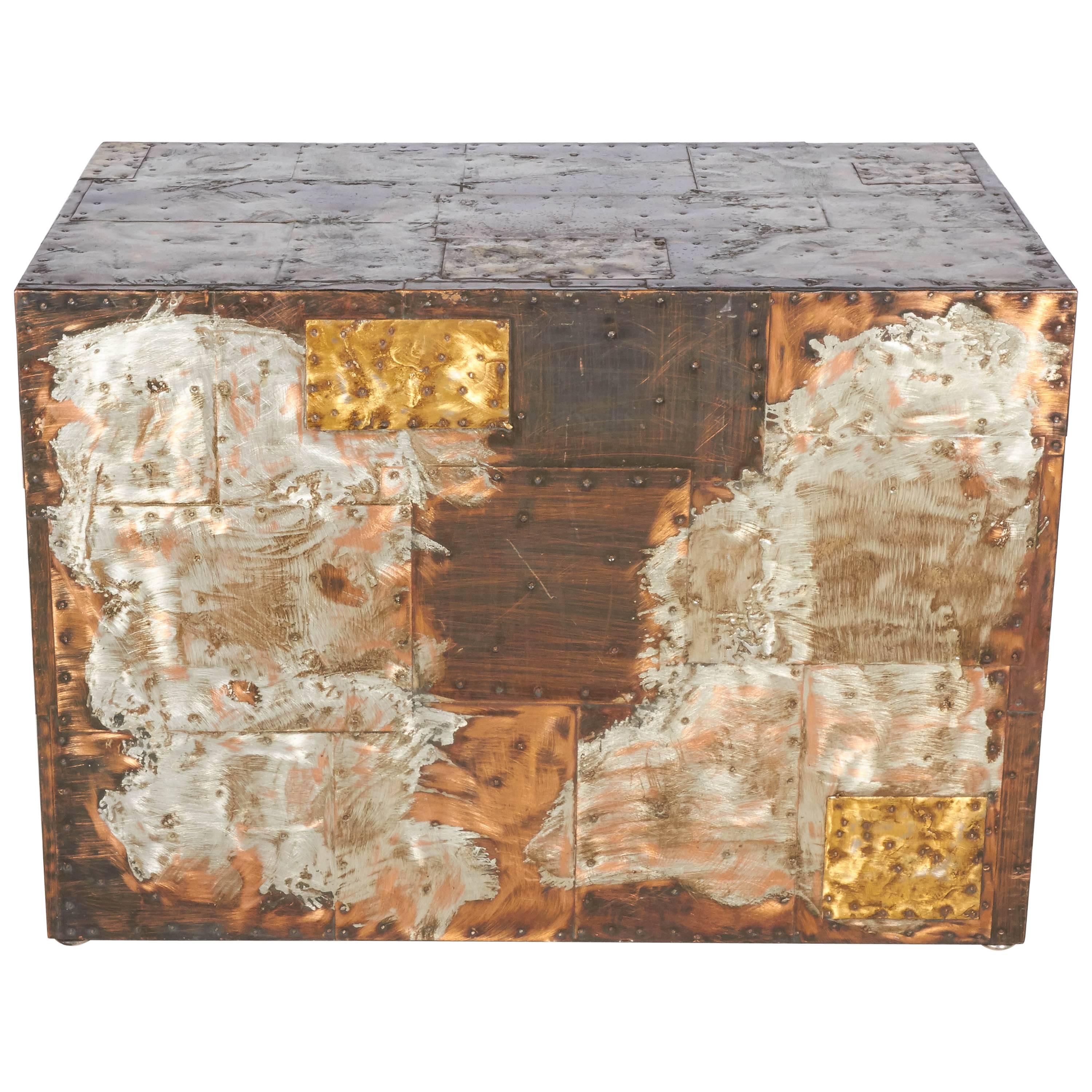 An example from Paul Evans Patchwork series, this piece has Evan's signature mixed metals of steel, copper, and bronze. The metals are welded and riveted and patinated to a wonderful effect. The piece is versatile in size and function and can be