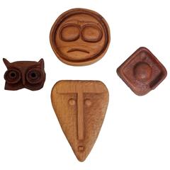 Set of Four Mid-Century Hand-Carved Walnut and Maple Decorative Masks