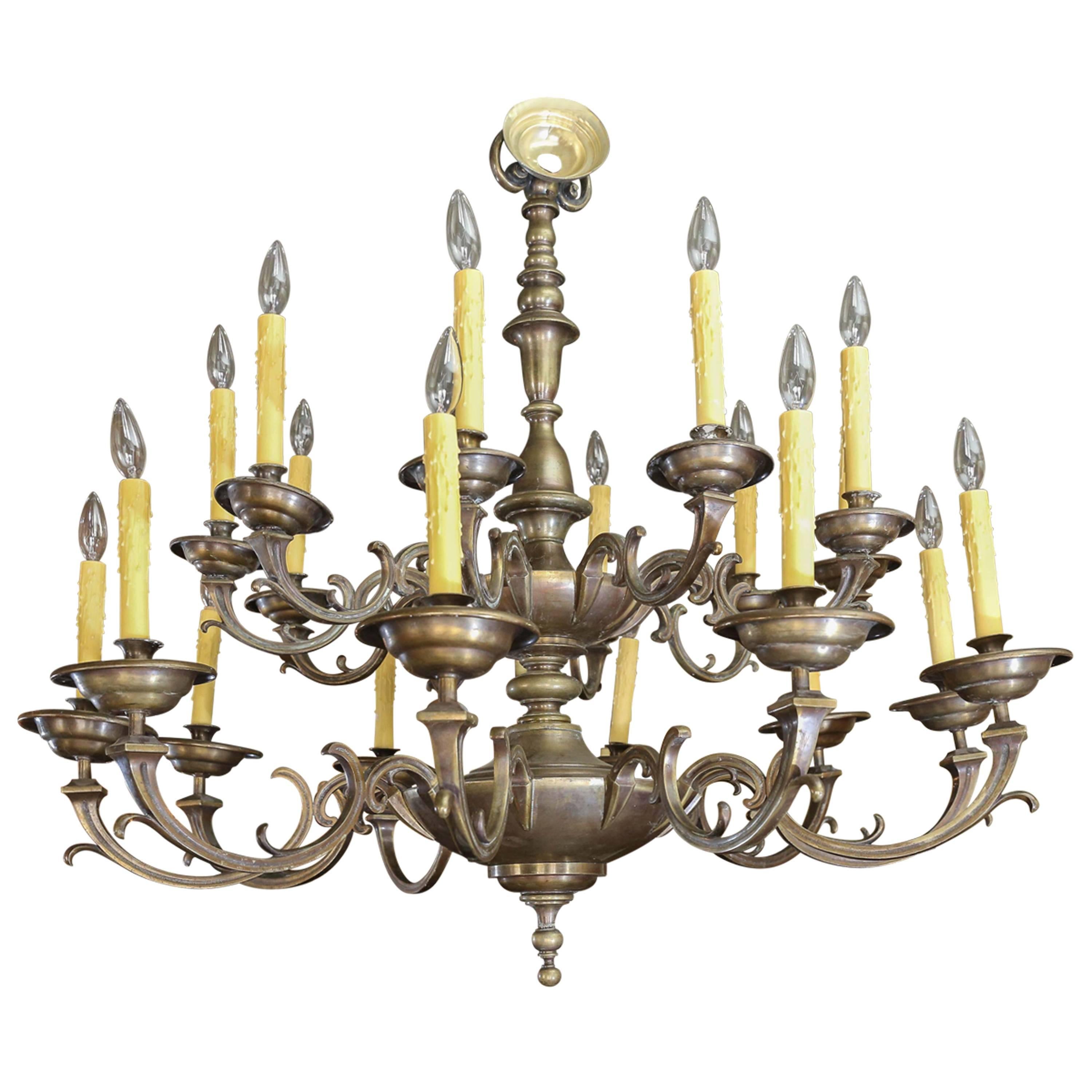 Large bronze and brass Belgian chandelier. This late 19th century Flemish style chandelier features twenty opposing C-scroll arms (two tiers with ten arms each). Newly wired for use within the USA using all UL listed parts. Includes canopy.