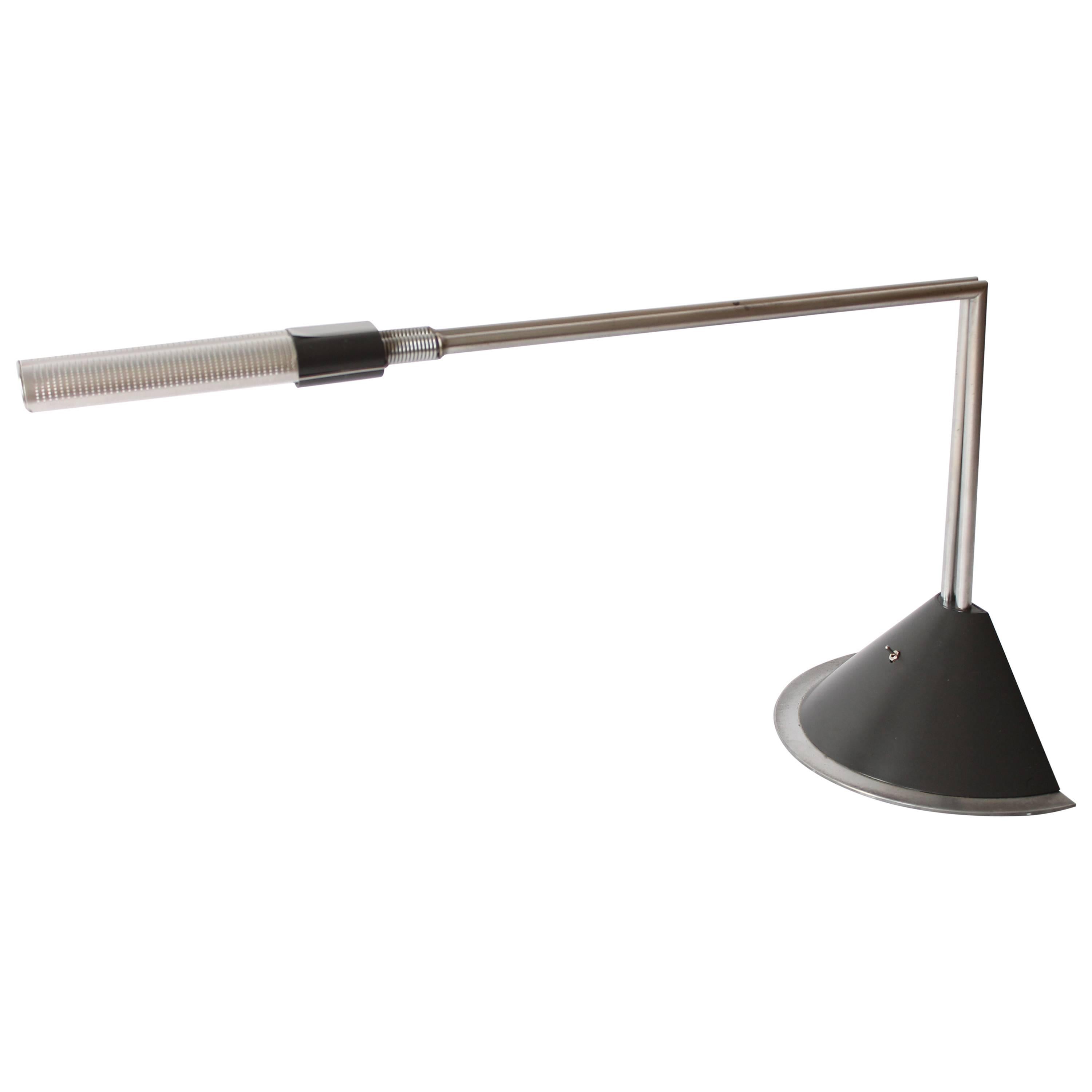 Designed by Ferdinand Alexander Porsche.

Model Sintetho Tavolo for Luci Italia, 1980s.

This Minimalist Industrial desk lamp is made out of aluminium, brushed stainless steel and plastic.

It use a standard G23 base fluorescent tube .

