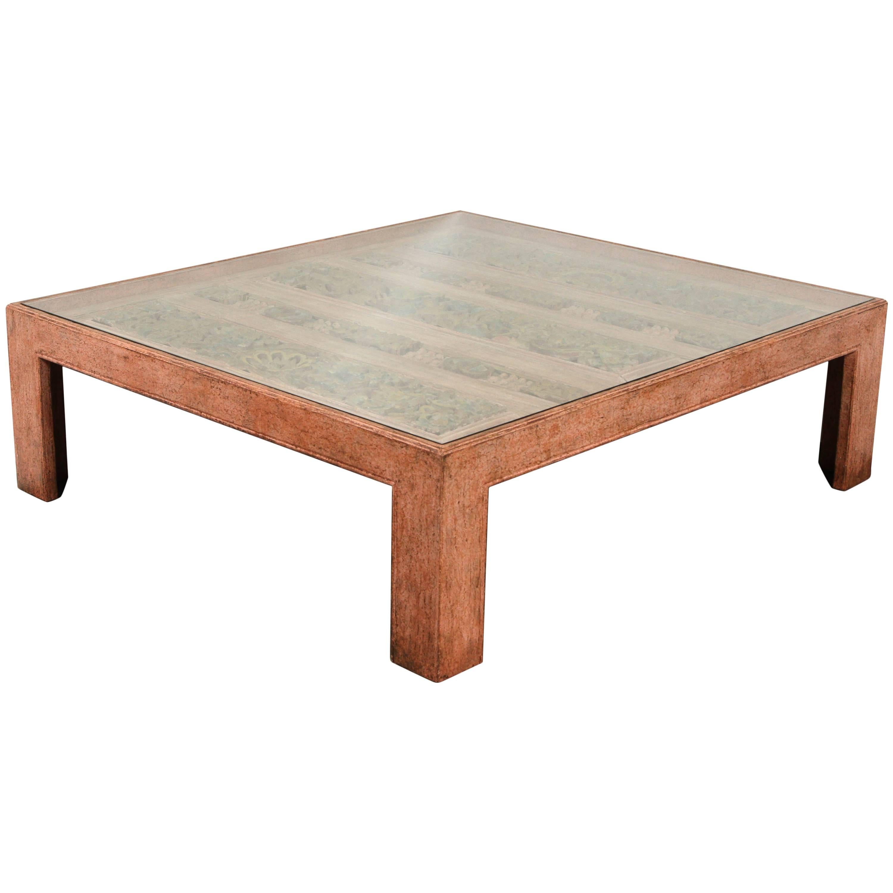 Large stunning Moroccan coffee table, square, hand-painted wood in washed light salmon color with a stunning collection of handcrafted architectural pieces from an antique door.
These handcrafted collection of architectural pieces were incrusted