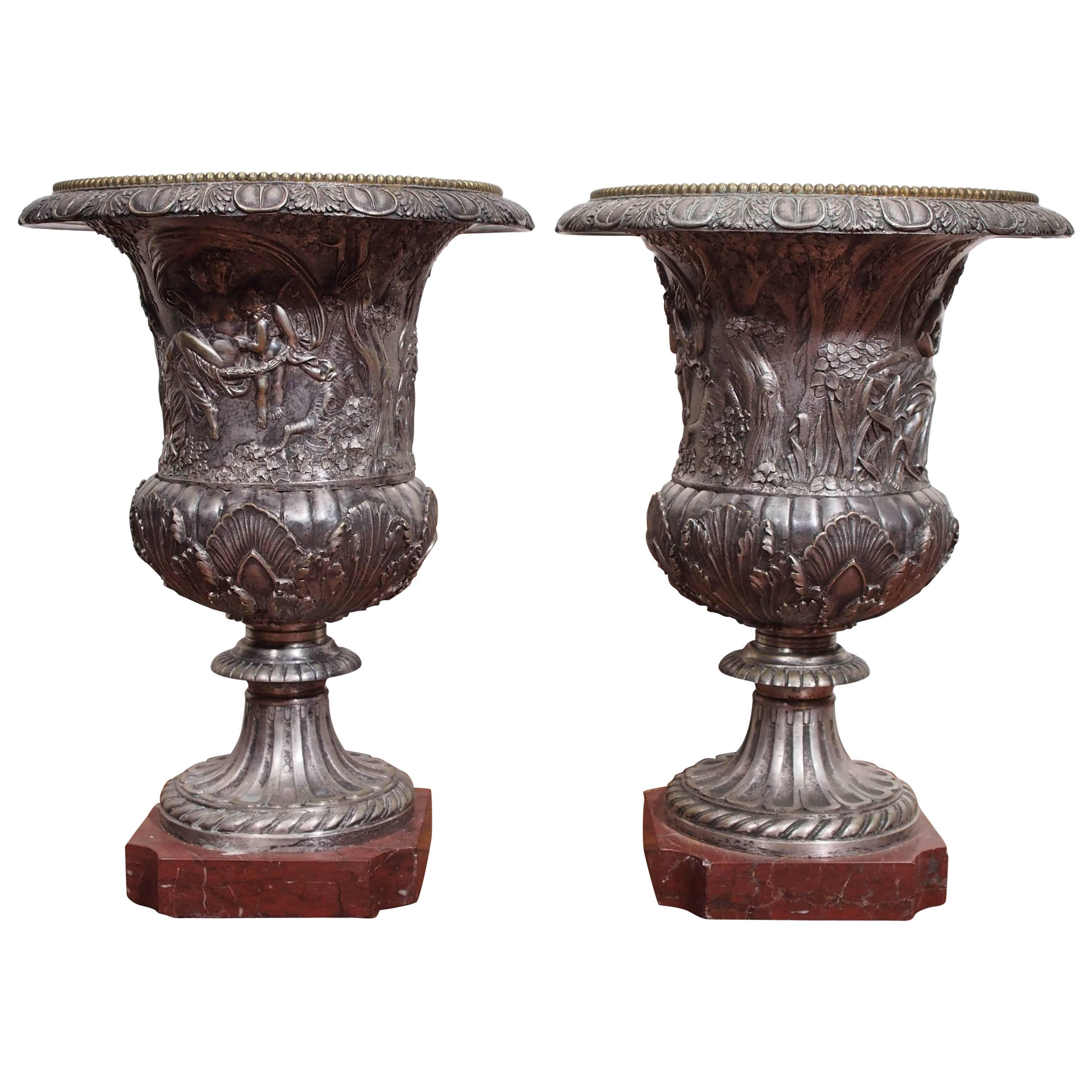 Pair of French Neoclassical Silver over Bronze Urns on Rouge Marble For Sale
