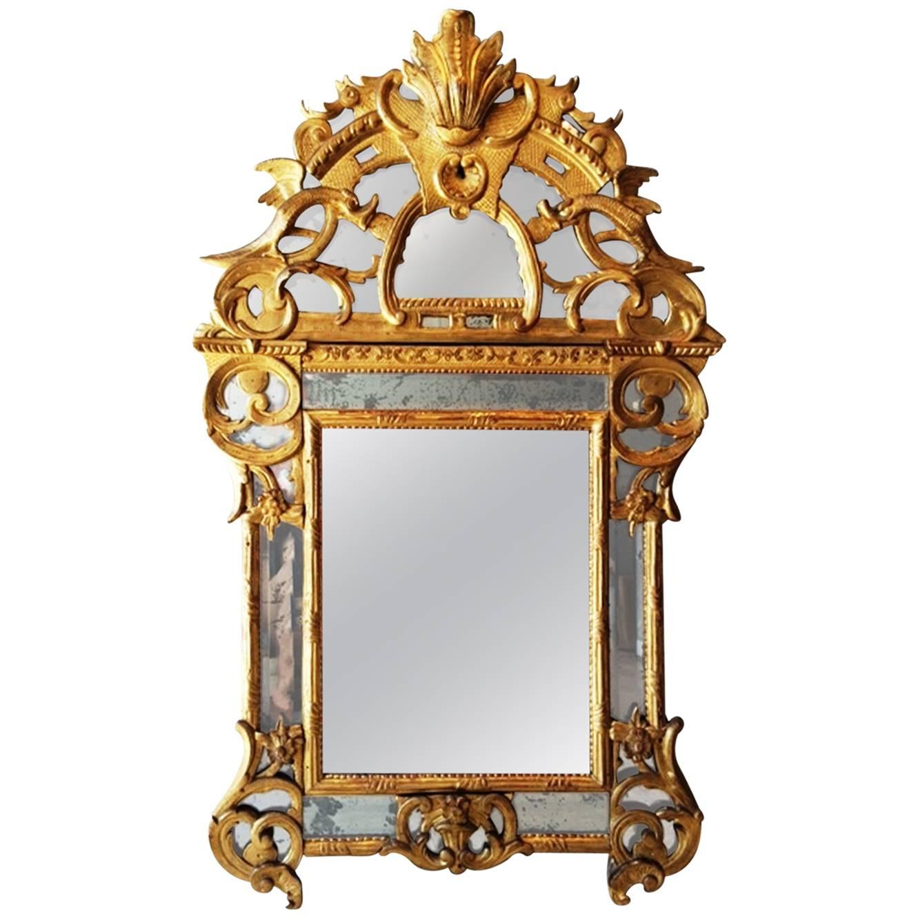 Spectacular French Regence Period Carved Giltwood Mirror, France, circa 1730 For Sale