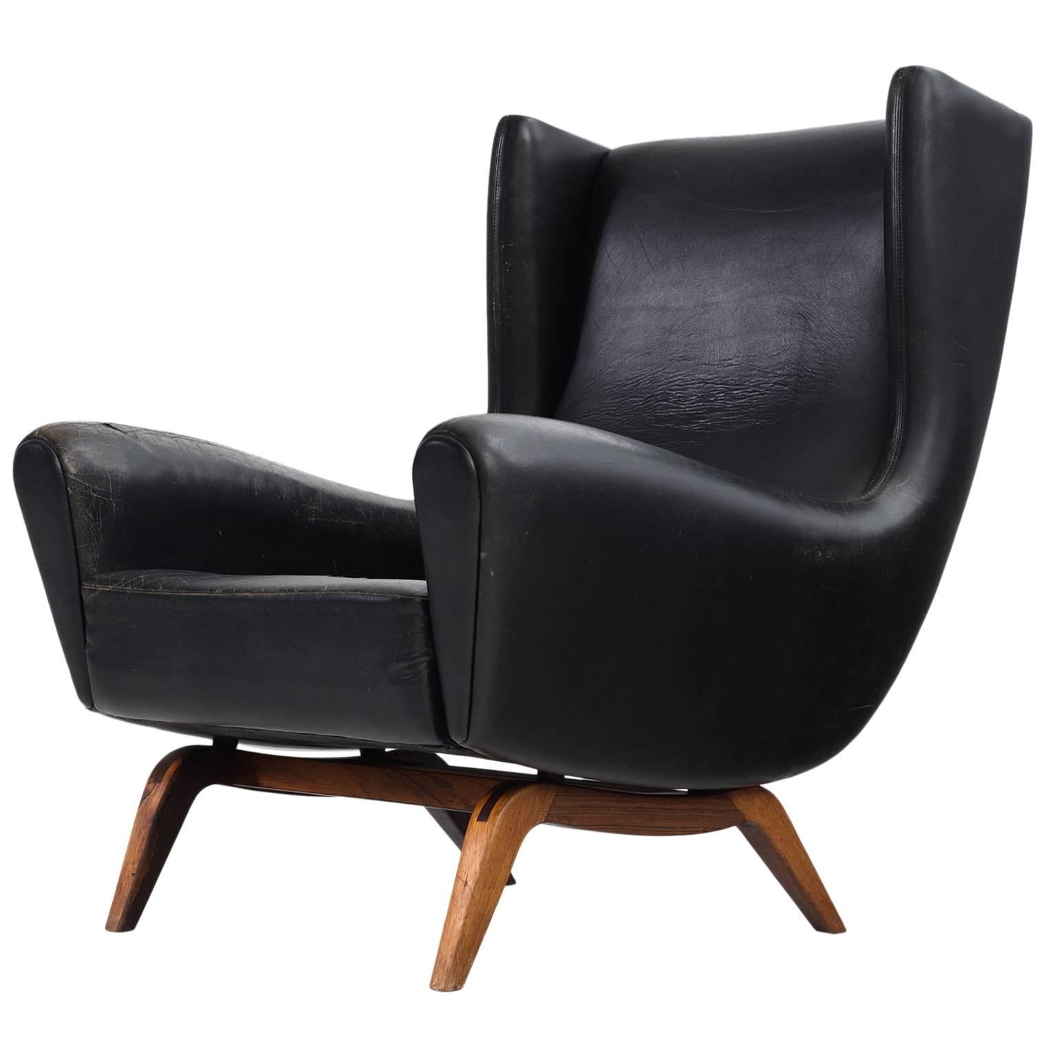 Illum Wikkelsø '110' Lounge Chair in Black Leather and Rosewood