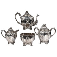 Antique 19th Century Four-Piece Wood and Hughes Repousse New York Coin Silver Tea Set