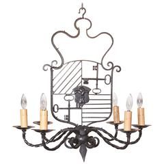 Early 20th Century French Black Iron Chandelier with Crest and Keys