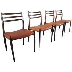 Niels Otto Møller Set of Four Rosewood Model 78 Dining Chairs Cognac Leather