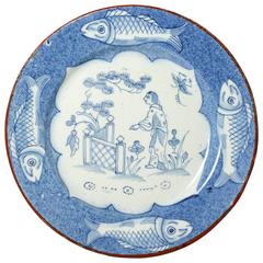 English Delftware Plate with Border Decorated with Fish, the Centre Panel Figure