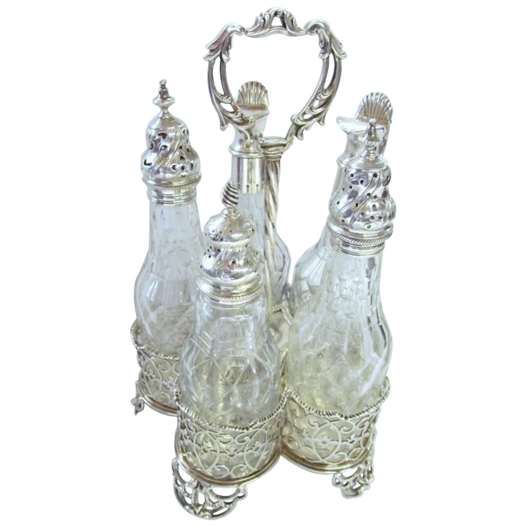 George III English Sterling Silver Five-Bottle Cut Crystal Warwick Cruet Set