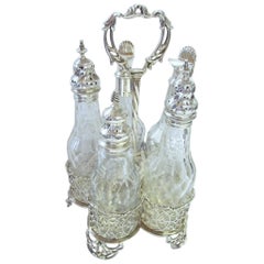 George III English Sterling Silver Five-Bottle Cut Crystal Warwick Cruet Set