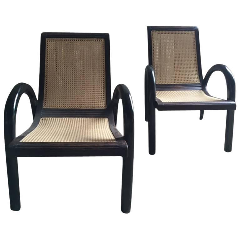 Pair of Ebony and Caned Low Armchairs For Sale
