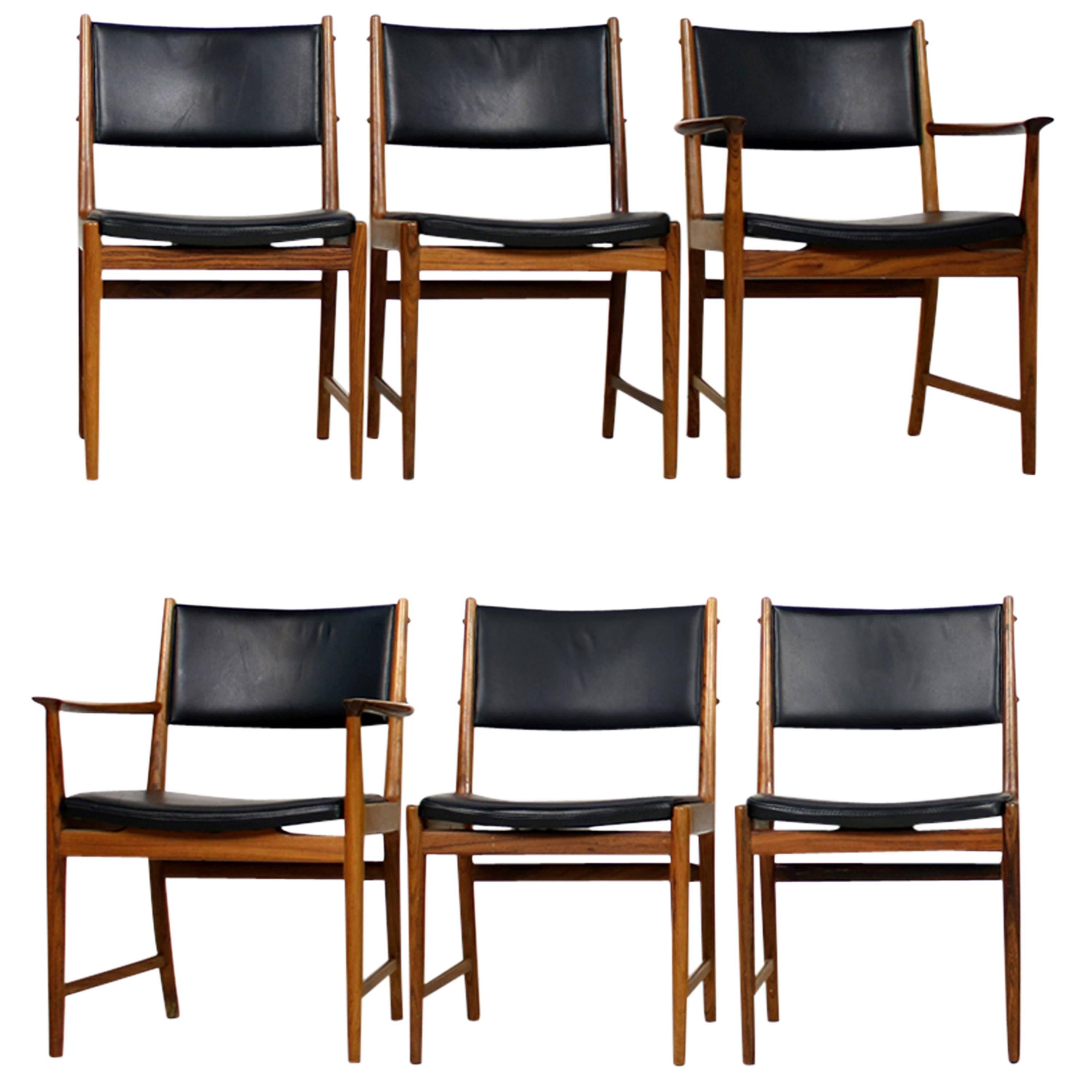 Amazing set of six Kai Lyngfeldt Larsen chairs, made by Soren Willadsen, Denmark in the 1960s. Overall two  armchairs and four standard chairs, rosewood and real leather in black, the chairs were restored, frames are authentic, the upholstery was