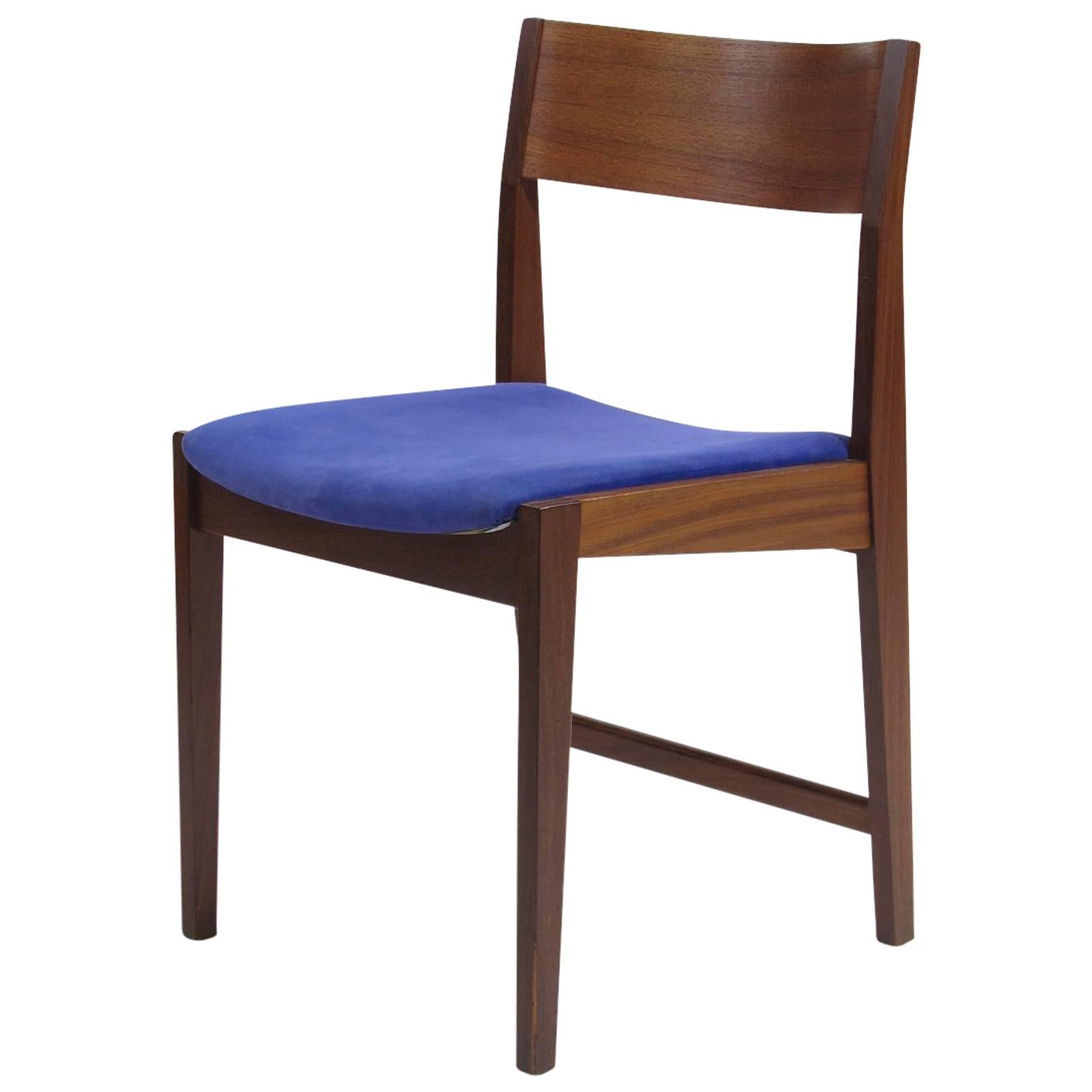 Mid-Century dining chairs attributed to Paul Cadovius for Cado. Crafted of solid walnut frames with dramatic curved backrests of teak. Solid construction, great for a residential or commercial environment. Upholstered in vintage blue ultra suede.