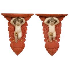 Pair of Carved and Painted Wood Putti Brackets