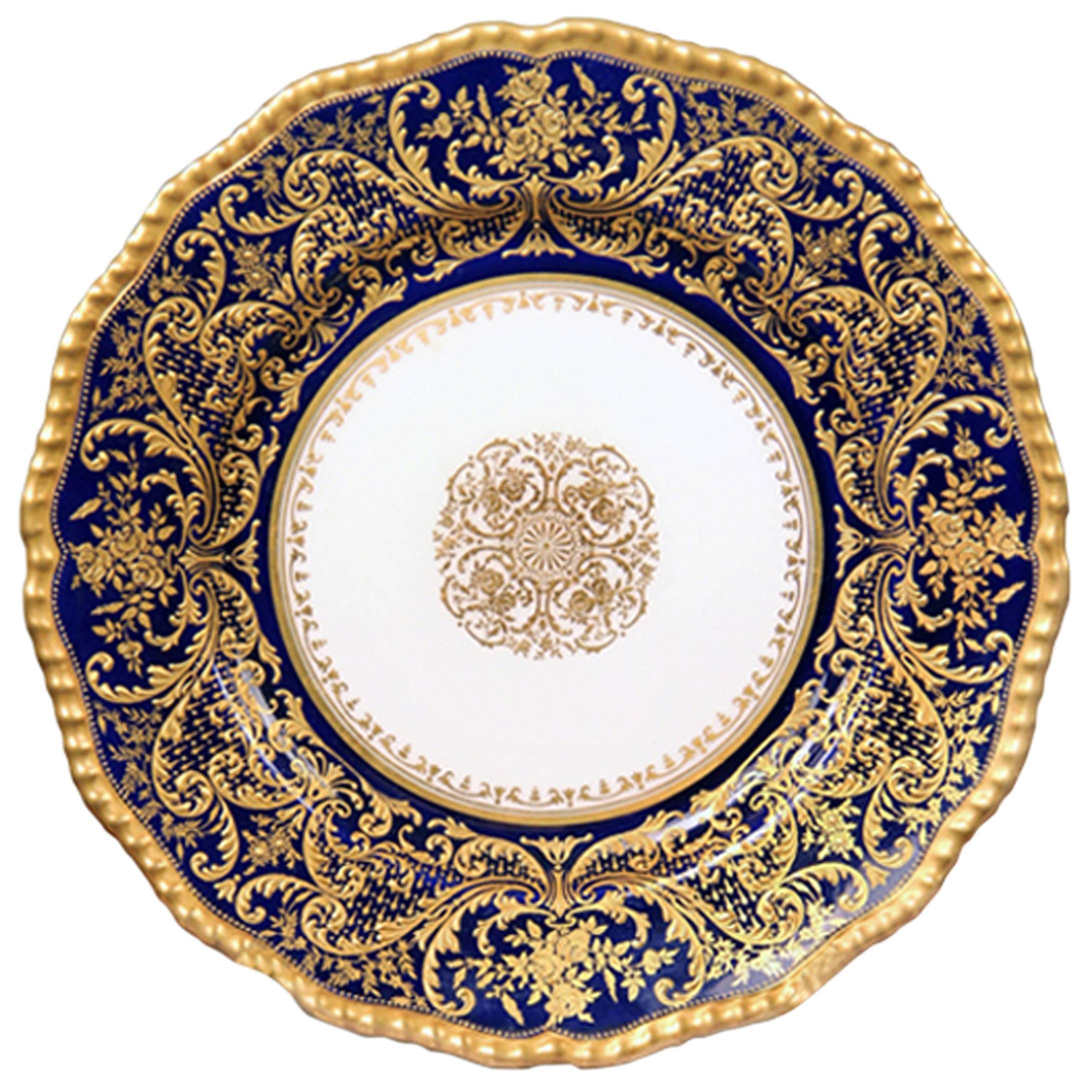 A fantastic quality set of 12, early 20th century English Doulton plates.

Very finely decorated with raised gold flowers and designs.

Stamped Doulton Burslem England, Gilman Collamore and Co New York on the back of the plates.