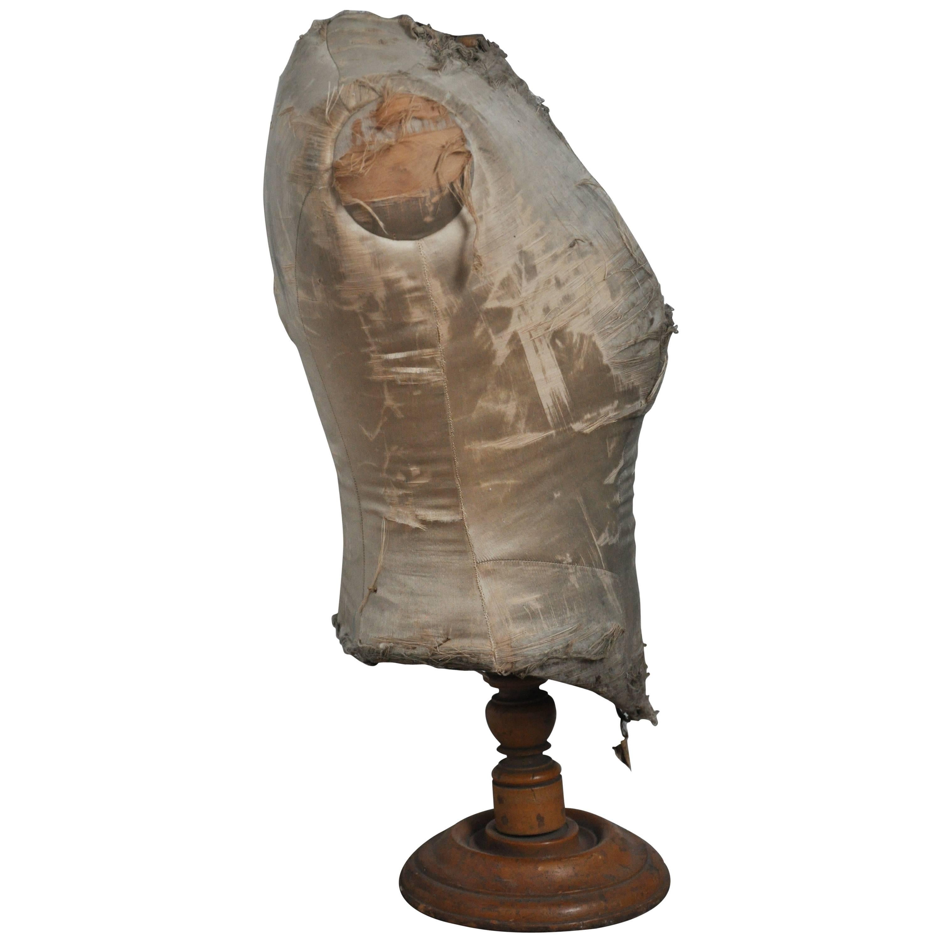 Late 19th century French Fabric Bust. 
Antique bust found in Paris was a shop display and is now a fantastic object with a rich and gorgeous patina. 
Turned wood base and original linen upholstery which is tattered and torn.

Dimensions: 16