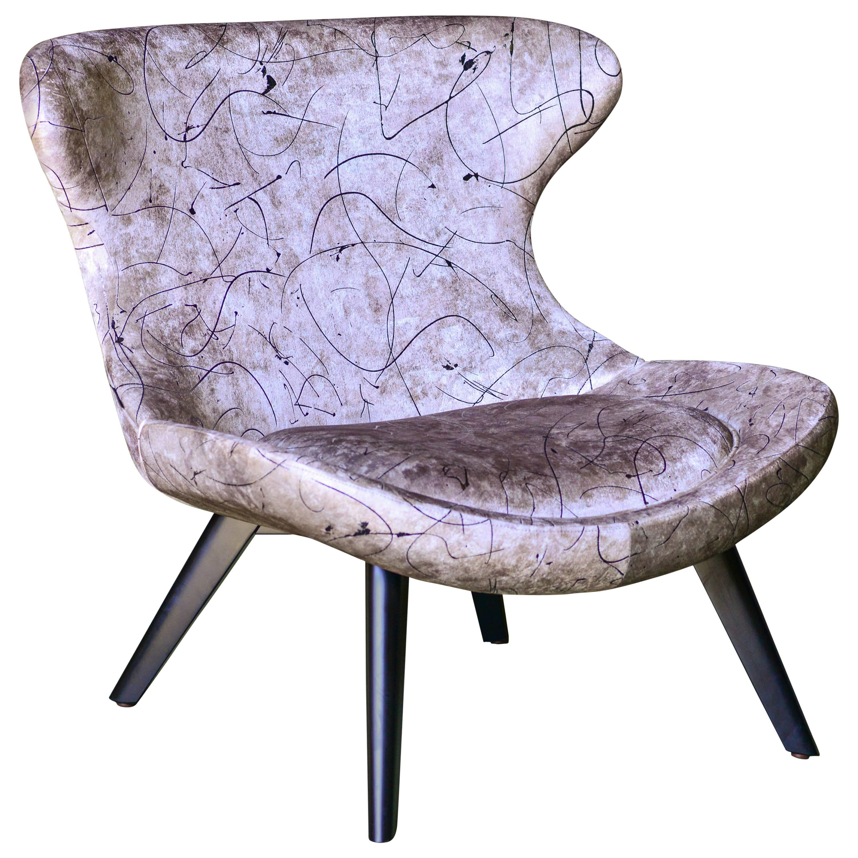 A very original lounge chair with modern clean Scandinavian lines and a touch of Space Age retro. Upholstered in European digitally printed velvet with a metallic foil atop, conveying the drama and scale of a modernist artists canvas. Solid wood