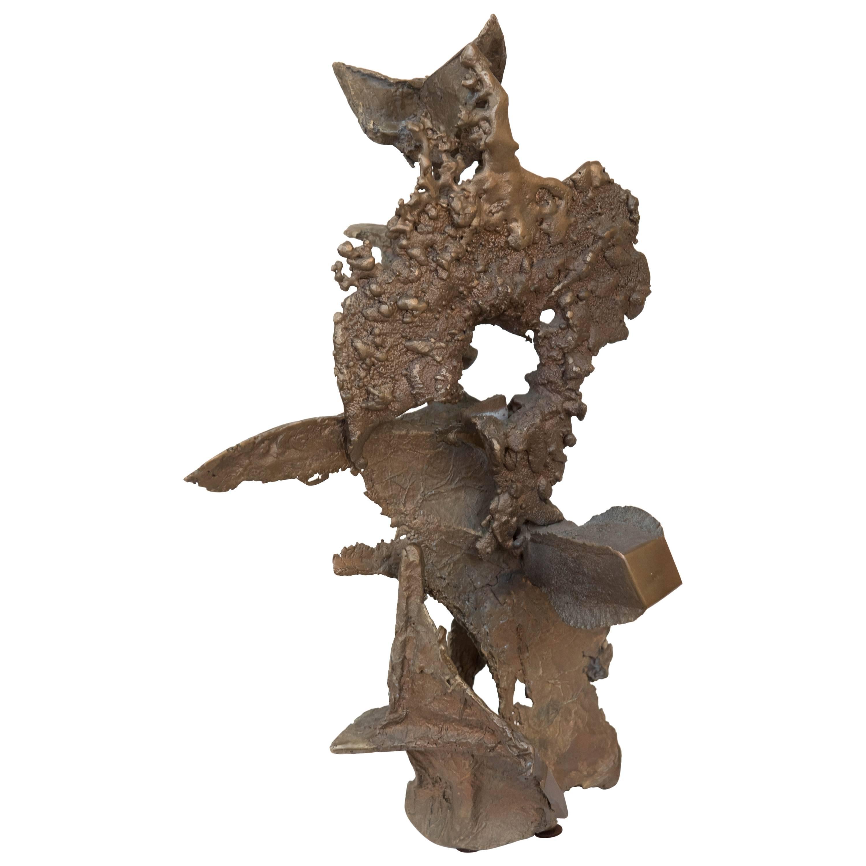 This weighty avant-garde Brutalist bronze sculpture makes a statement from many different angles. Put on a pedestal or on a large table to bring texture and 