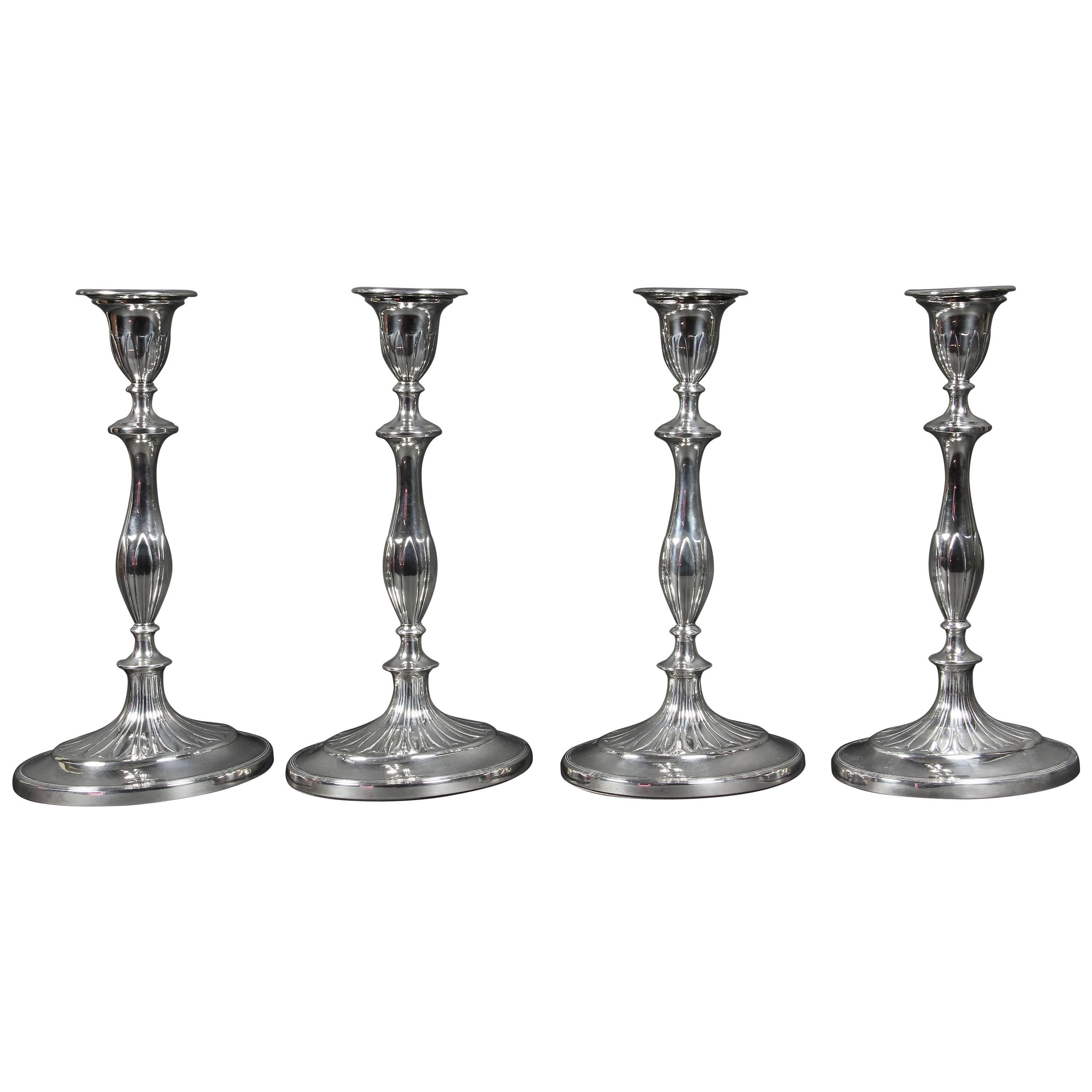 Set of Four George III Sterling Candlesticks