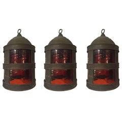 Set of Three Arts & Crafts Tole and Amber Glass Lanterns