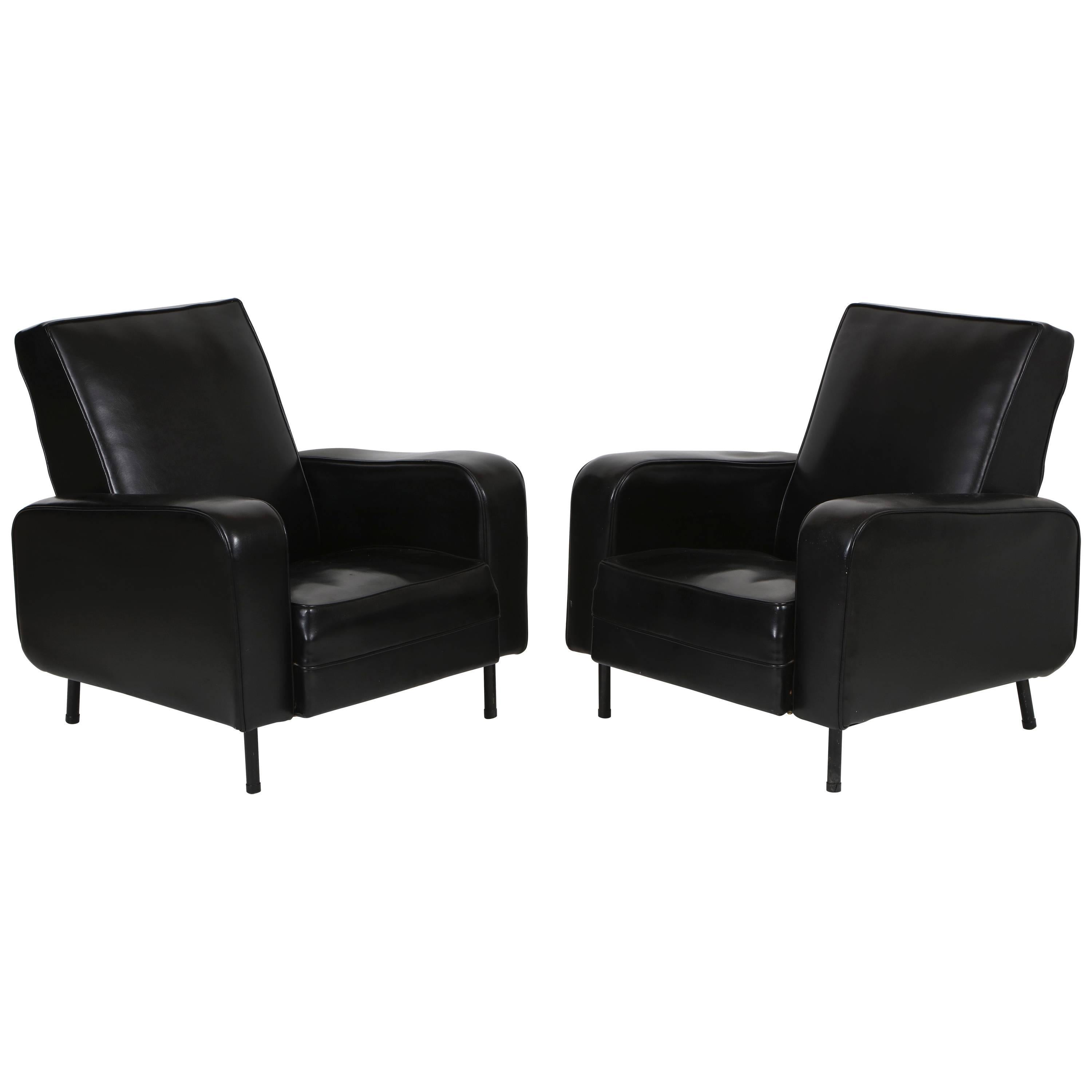 Guariche Attributed Airborne Chairs 1950s black faux leather lounge Mid-Century, France.

Deep and comfortable chic black lounge chairs. Original vintage condition.

Height: 34 inches.
Depth: 27 inches.
Width: 29 inches.
Seat height: 15